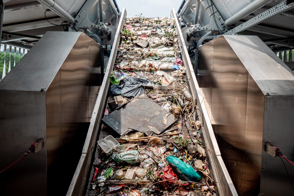 Conveyor belt with debris in Klang River, Malaysia