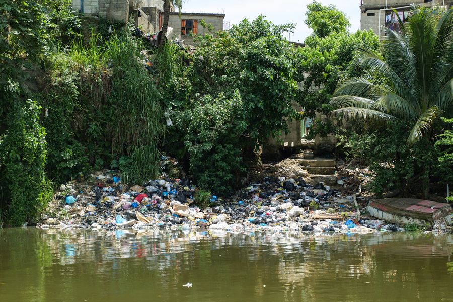 Plastic pollution on a river bank close to one of The Ocean Cleanup's Interceptors in Dominican Republic